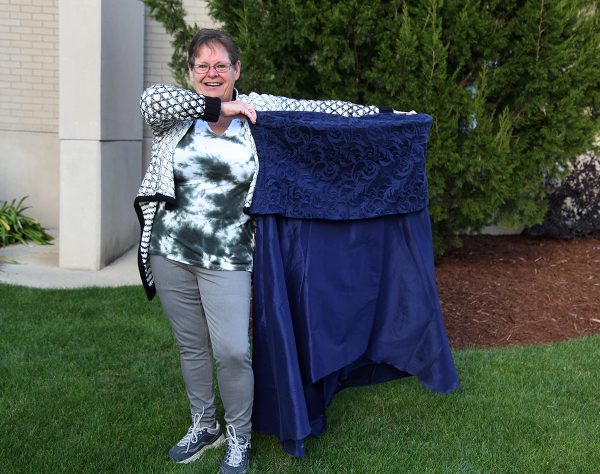 Yvette shows off her old dress that she can't fit anymore.