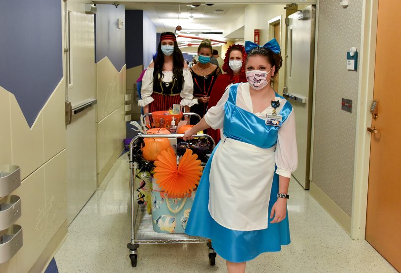 People in costumes with cart