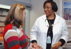 Female patient talking to female doctor