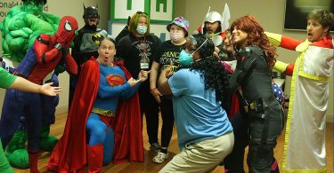 Patients surrounded by superheroes
