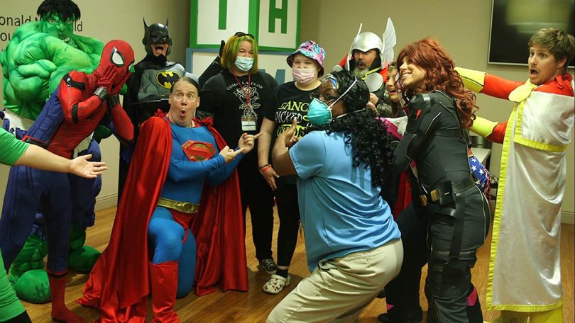 Patients surrounded by superheroes