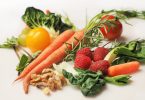 Fruits and vegetables laying on a table