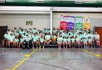 A group of people sitting on bleachers