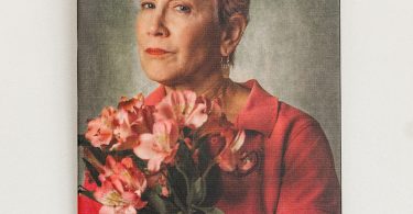 Woman in pink holding flowers