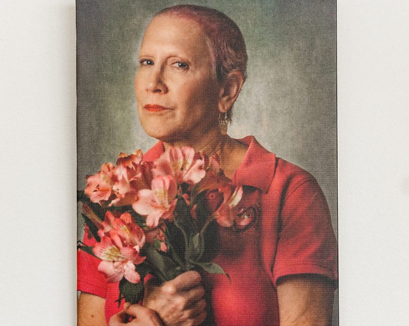 Woman in pink holding flowers