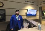 Man standing behind desk