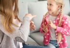 Girl and mom using sign language