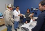 Hispanic family with doctor and interpreter