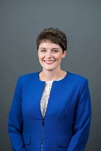 Woman in blue smiling in portrait