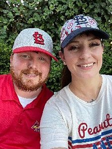 Couple in baseball hats