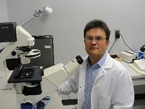 Man in lab with microscopes