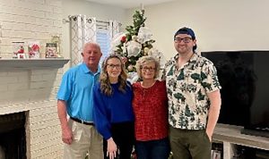 Four people posing for photo