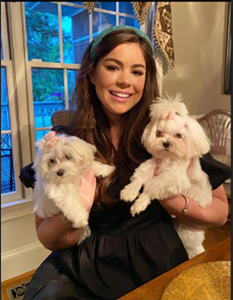 Woman with two white dogs