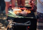 Person grilling meat photo