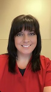 Women in red shirt smiling 