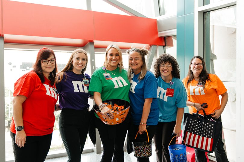 Group of people dressed as M&Ms