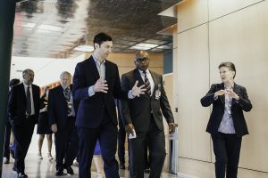 Group of people walking in a hallway